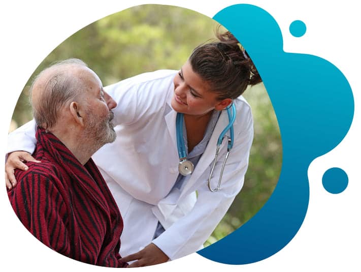 A female researcher engaging a patient as they discuss current findings and next steps