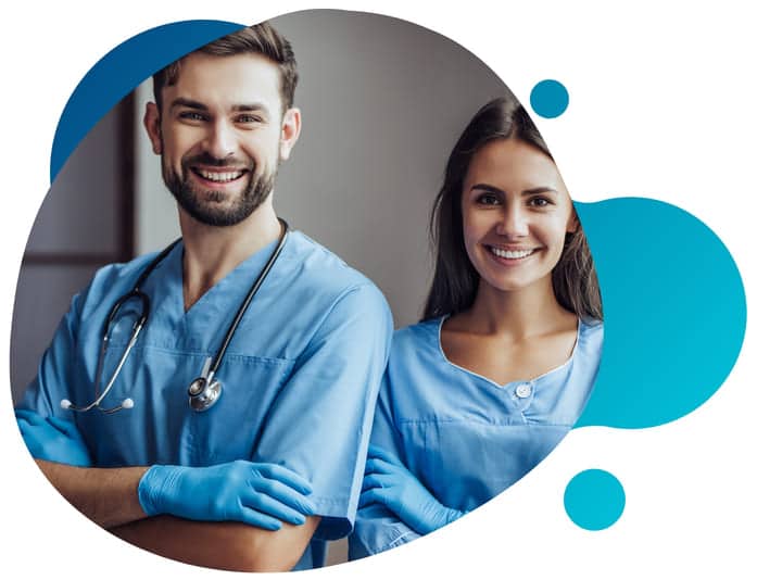 Two happy doctors and medical researchers smiling as they stand next to each other