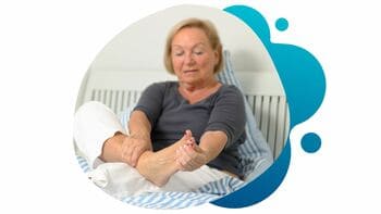 Diabetic Peripheral Neuropathy (DPN) A mature woman with DPN touching her feet in discomfort and pain