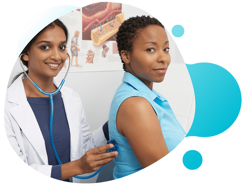 Nurse and doctor supporting female patient