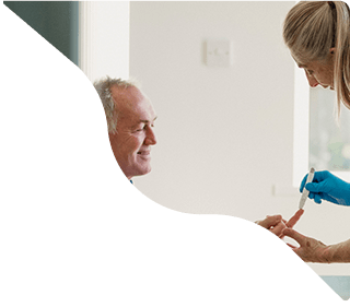 Elderly man consulting with female doctor