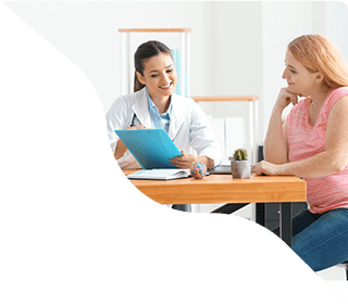 Patient consultation with female doctor at clinic