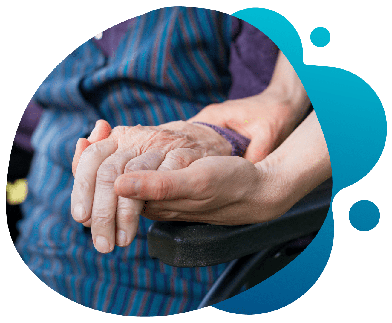 Elderly man holding hands with caregiver