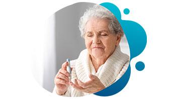 current-studies-diabetes Elderly woman taking medication