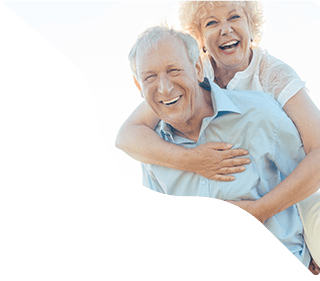Elderly couple hugging in hospital