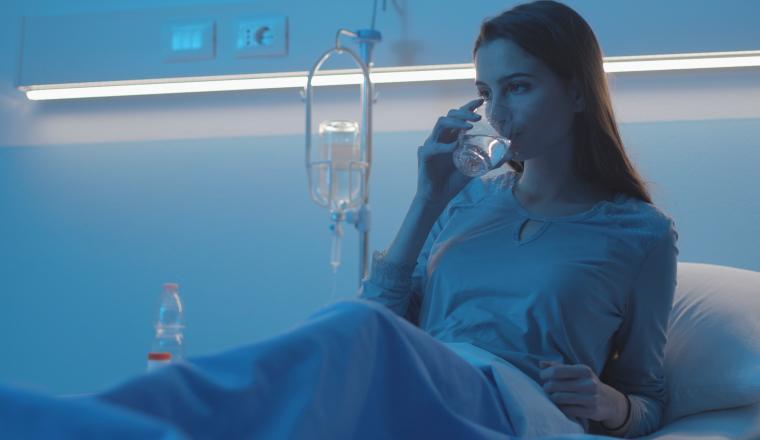 The patient is drinking water