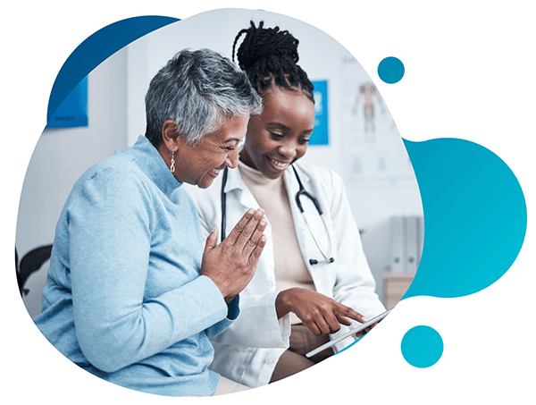 Friendly doctor with smiling patient at clinical research facility Conquest Research