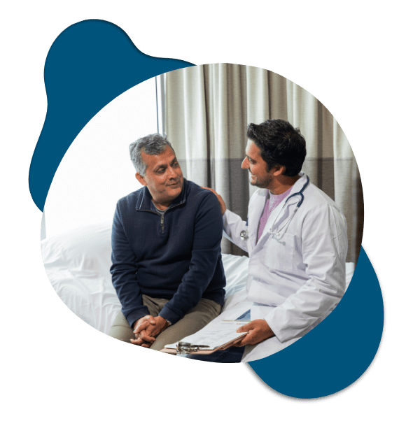 Two men in medical consultation with a doctor