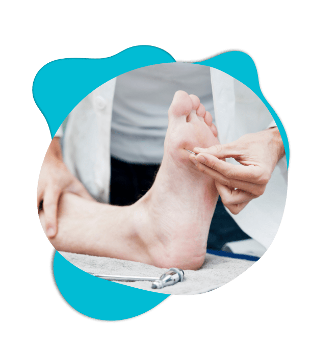 Doctor examining foot during clinical assessment